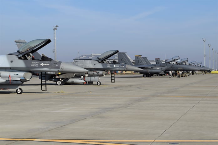 US Air Force F-15E Strike Eagles and F-16 fighter jets in flight, the aircraft being cut from NATO's European posture