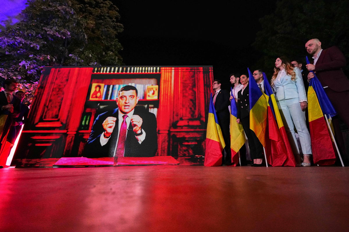 Romanian hard-right leader George Simion addresses supporters