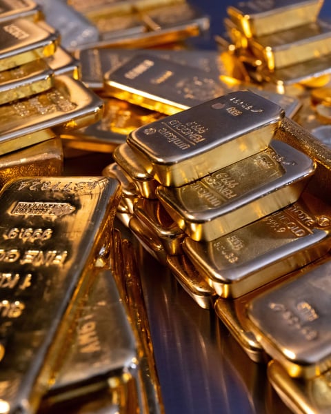 Stacked gold bullion bars in a central bank vault as ECB confirms gold has overtaken US Treasuries in global reserves