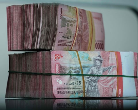 Yuan and rupiah banknotes as Hong Kong, Indonesia and the People's Bank of China sign a direct currency settlement MoU