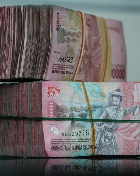 Yuan and rupiah banknotes as Hong Kong, Indonesia and the People's Bank of China sign a direct currency settlement MoU