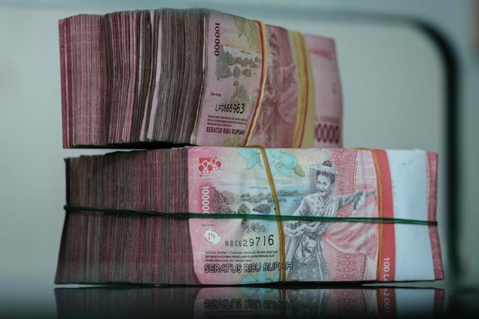 Yuan and rupiah banknotes as Hong Kong, Indonesia and the People's Bank of China sign a direct currency settlement MoU