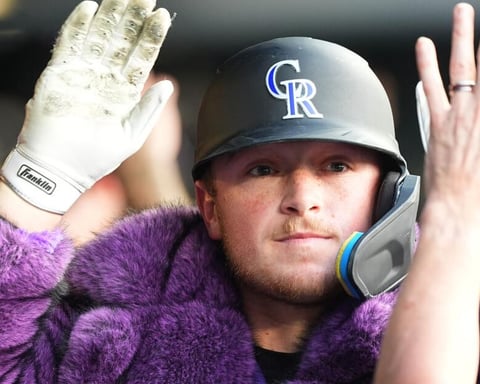Hunter Goodman gestures after hitting a two-run home run for the Colorado Rockies against the Chicago Cubs at Coors Field on June 9, 2026
