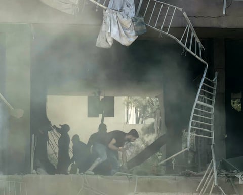 Smoke rises over Dahieh, Beirut's southern suburb, following an Israeli airstrike targeting a Hezbollah command center on June 14, 2026