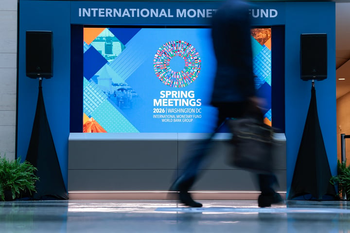 Delegates walk through the atrium at the IMF and World Bank Spring Meetings in Washington DC, April 14, 2026