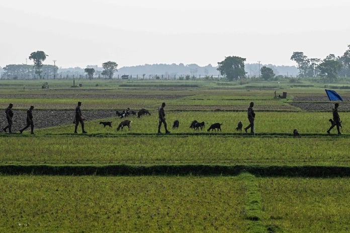 Border Guard Bangladesh personnel patrol near the Benapole-Petrapole frontier crossing on the India-Bangladesh border