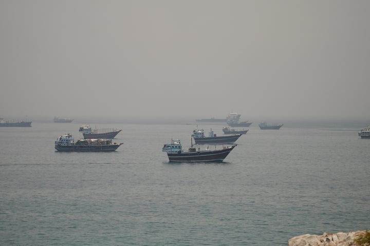 Commercial vessels and tankers stranded in the Strait of Hormuz during the US naval blockade against Iranian oil exports, with Indian sailors among those unable to leave the conflict zone