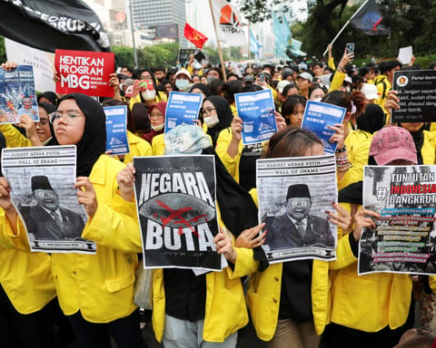University students take part in a protest against government policies in Jakarta