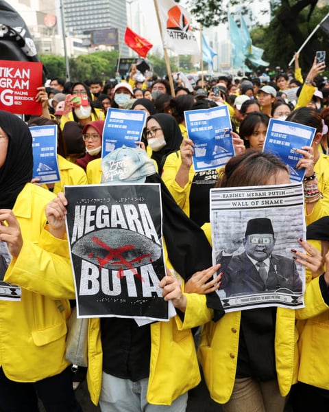 University students take part in a protest against government policies in Jakarta