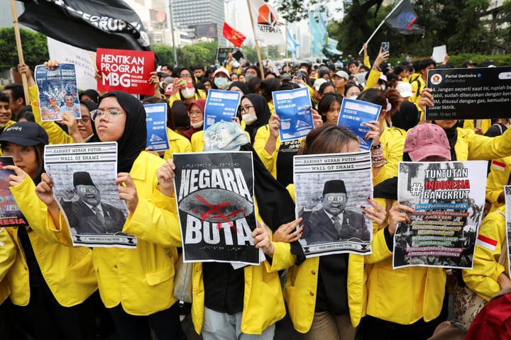 University students take part in a protest against government policies in Jakarta