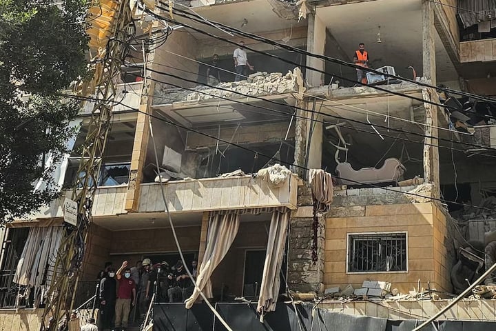 First responders inspect damage at apartment building hit by Israeli airstrike in Beirut Dahiyeh suburb June 2026