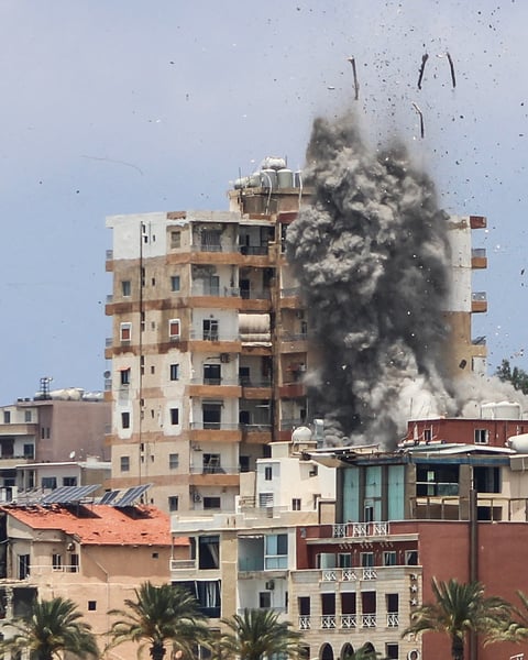 Smoke and debris rise over Tyre, southern Lebanon, after an Israeli air strike on June 9, 2026