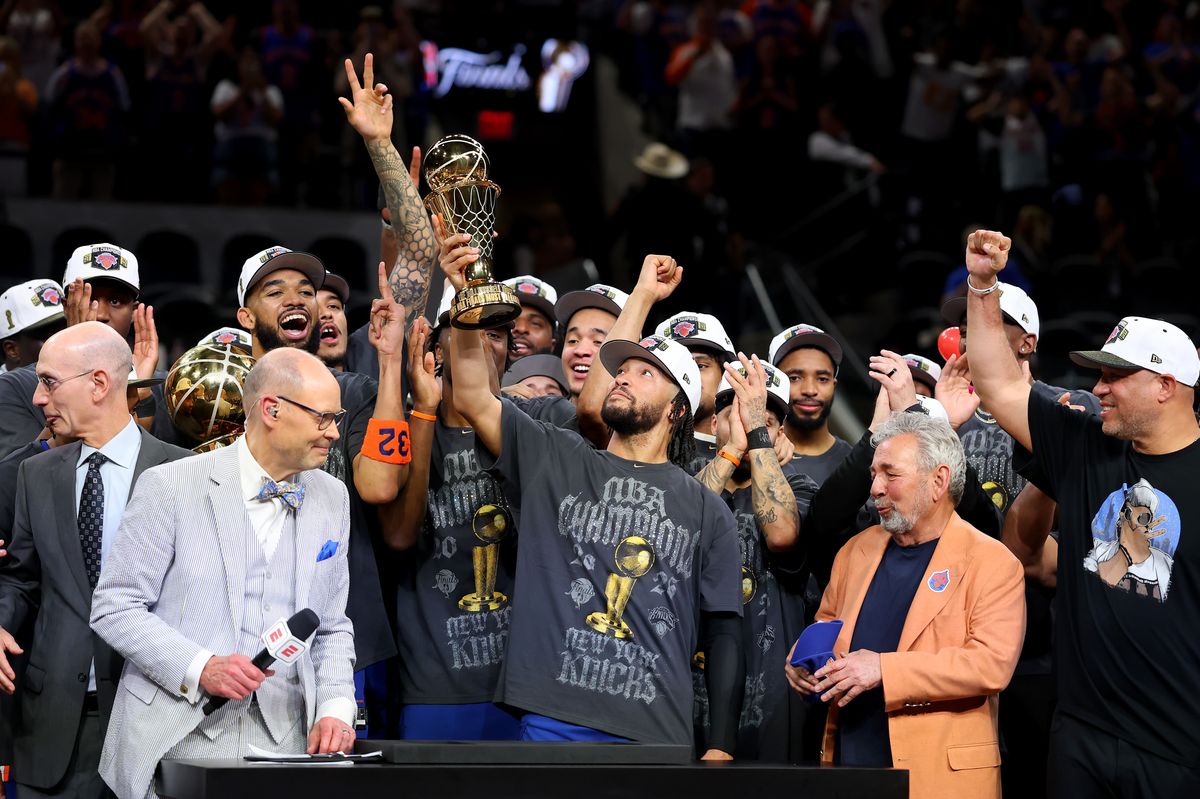 Jalen Brunson lifts the 2026 NBA Finals MVP trophy after the New York Knicks defeated the San Antonio Spurs to win the championship