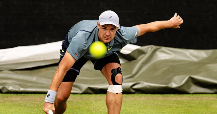 Kamil Majchrzak competing on grass at the Libema Open 2026 in s-Hertogenbosch
