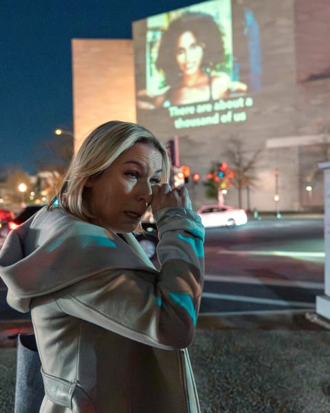 Danielle Bensky wipes a tear at a World Without Exploitation event calling on Congress to pass the Epstein files transparency act