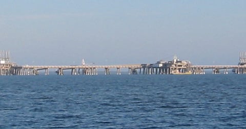 An LNG terminal with storage tanks, illustrating a liquefied natural gas story