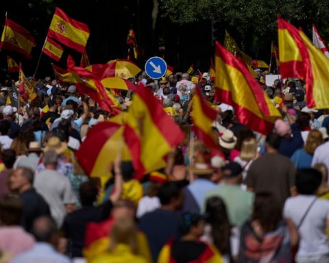 Demonstrators with Spanish flags protest against Pedro Sanchez's government in Madrid