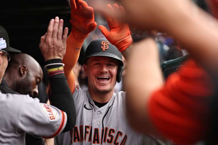 Matt Chapman of San Francisco Giants celebrates in dugout after hitting grand slam against Chicago Cubs at Wrigley Field June 2026