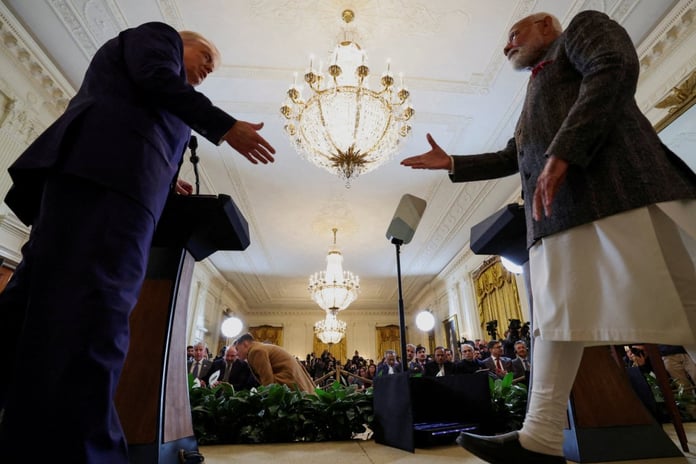 US President Donald Trump and Indian Prime Minister Narendra Modi shake hands at a joint press conference at the White House in Washington in February 2025