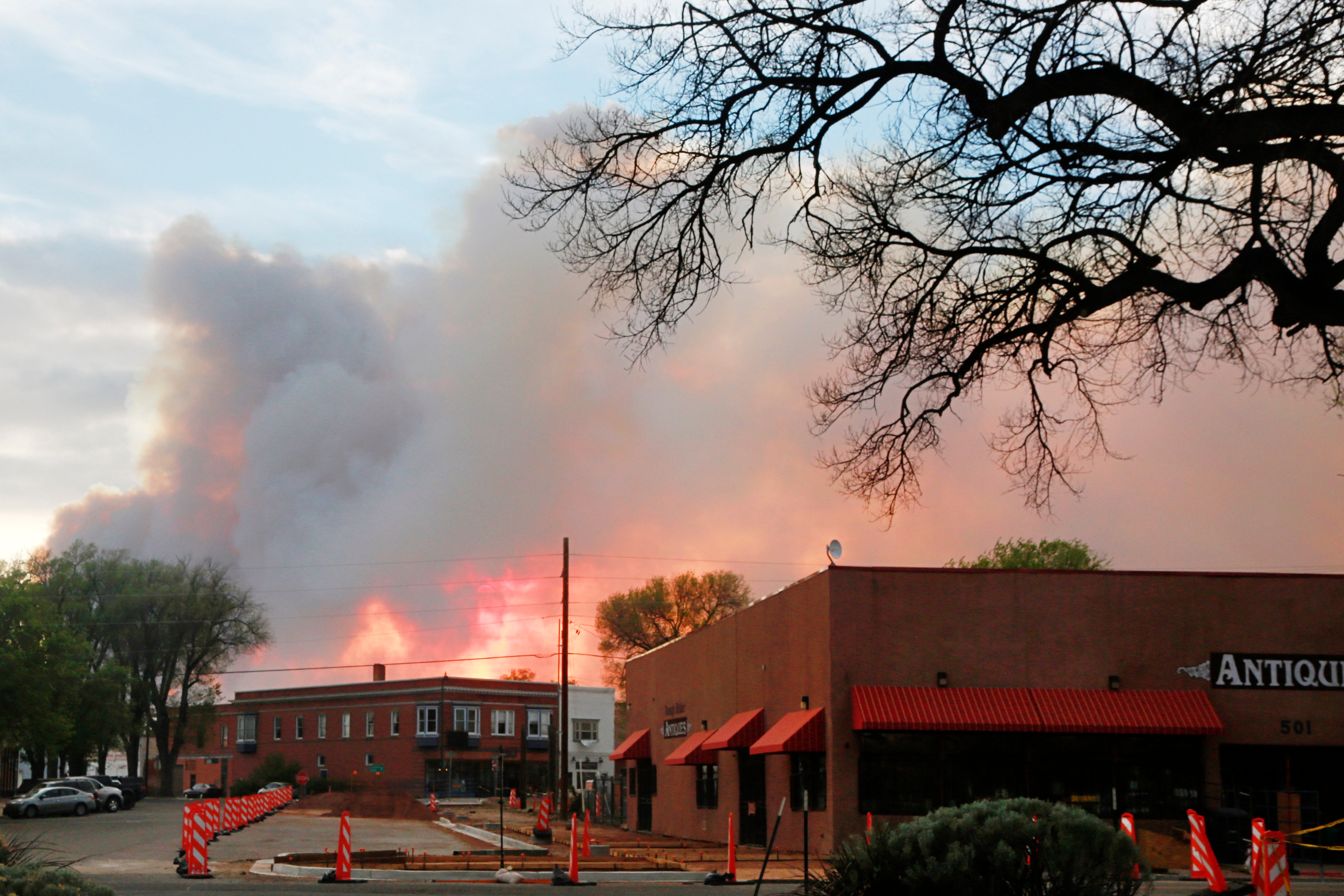 Firefighters work a wildfire northeast of Santa Fe, New Mexico, the kind of operation that has multiplied as drought-stressed forests die back