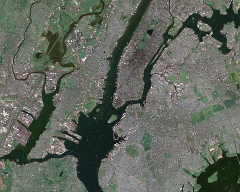 NASA Landsat 7 ETM+ satellite image of New York City showing southern Manhattan with the Financial District at the southern tip the Hudson River the East River Ellis Island Brooklyn Queens and the bridges connecting the boroughs