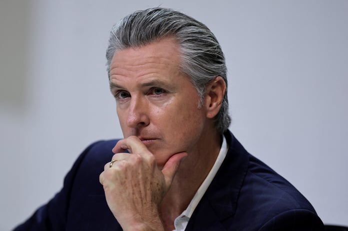 California Governor Gavin Newsom attends a news conference during the UN Climate Change Conference in Belem, Brazil, after Trump-era rollbacks of state emissions rules