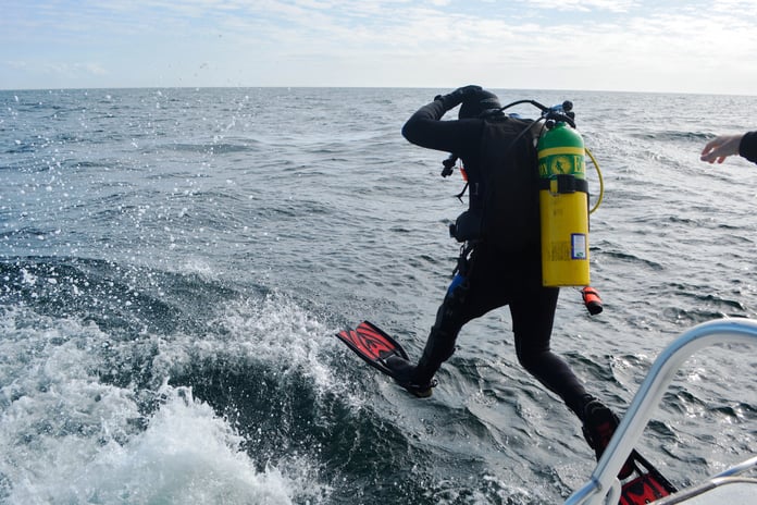 A NOAA scientific monitoring buoy being deployed at sea, the kind of ocean observing instrument the US is now removing