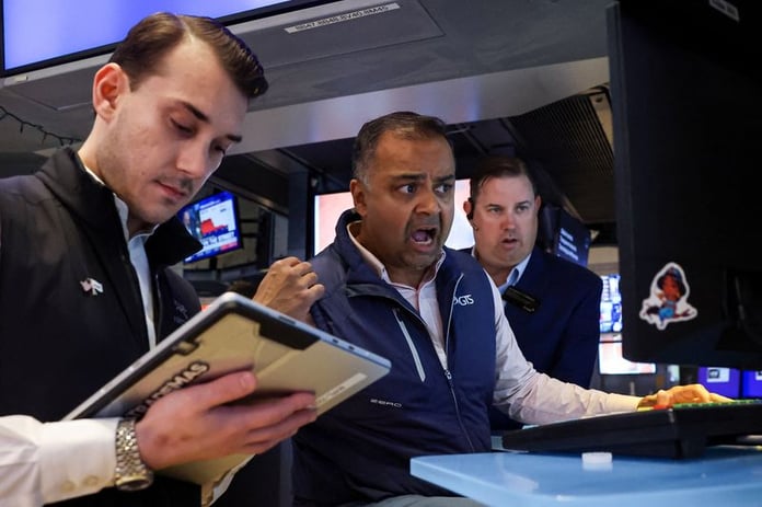 Traders work on the floor of the New York Stock Exchange on June 5 2026 as May jobs report fuels Fed rate hike bets