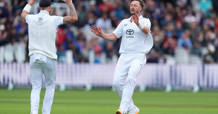 England seamer Ollie Robinson celebrates with Ben Stokes after dismissing Rachin Ravindra at Lord's on day three of the first Test against New Zealand, June 6, 2026