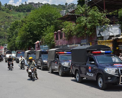 Security personnel patrol a street in Muzaffarabad, capital of Pakistan-administered Kashmir, before the Joint Awami Action Committee protest