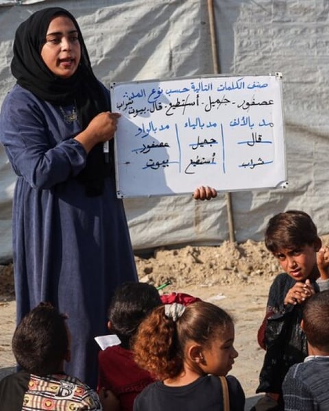 Destroyed school building in Gaza amid rubble from Israeli strikes