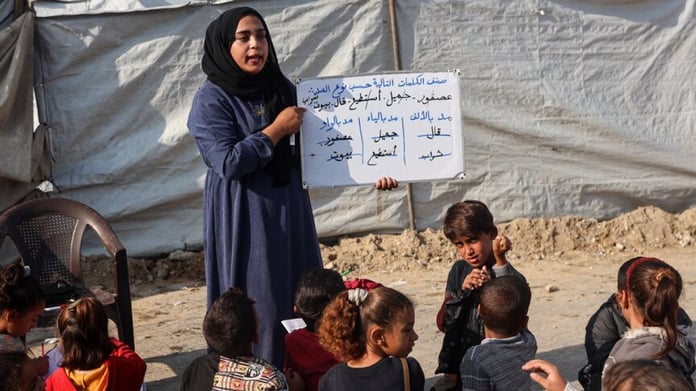 Destroyed school building in Gaza amid rubble from Israeli strikes