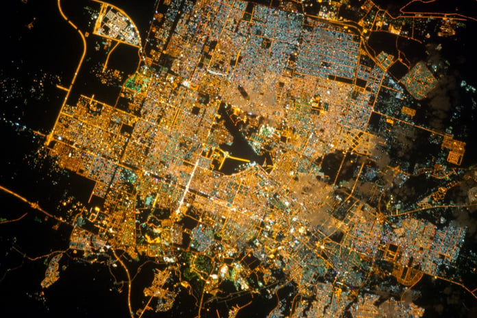 NASA astronaut photograph of Riyadh Saudi Arabia at night from the International Space Station showing the brightly illuminated capital radiating along ring roads from a glowing central business district