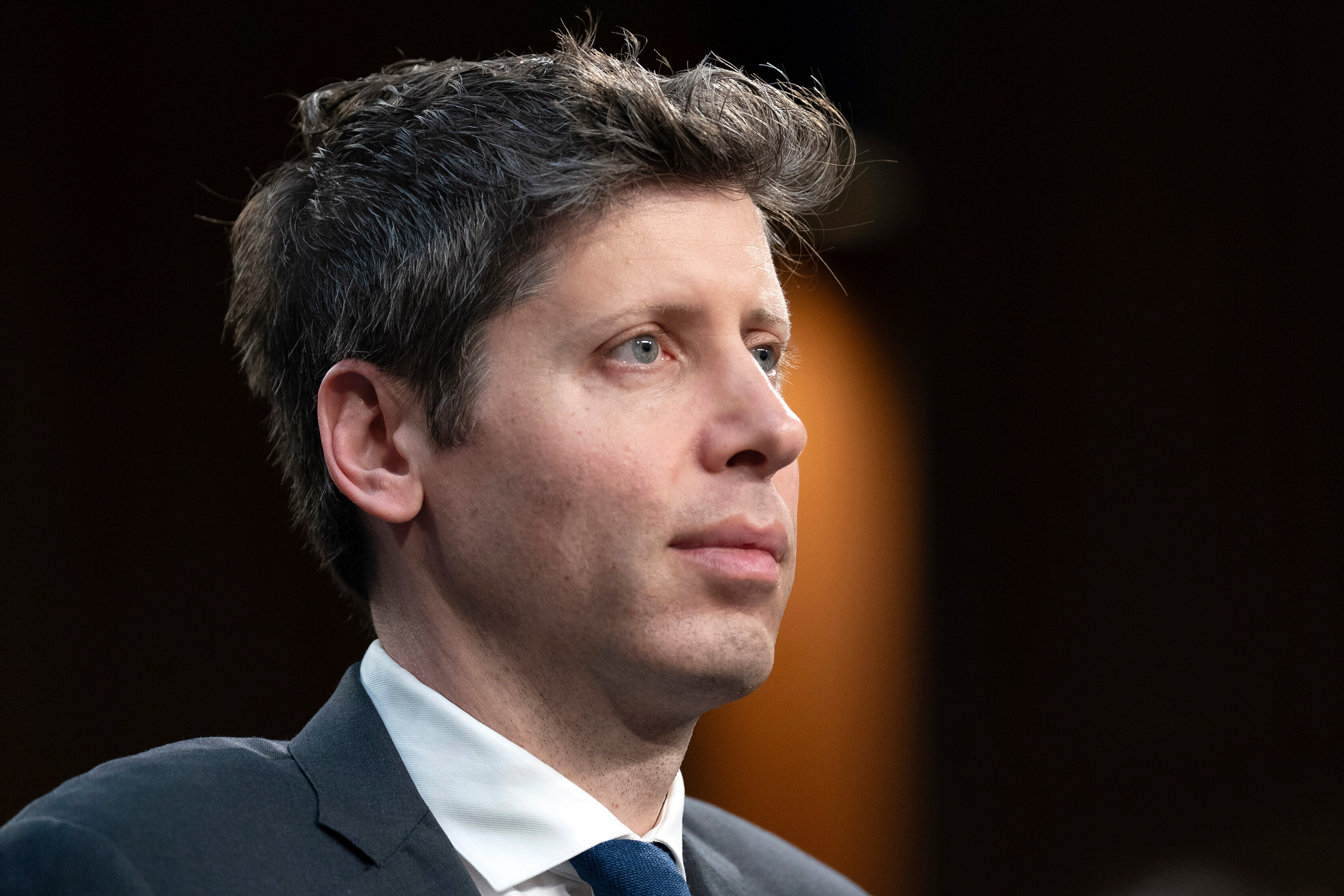 OpenAI CEO Sam Altman testifying before a Senate committee at a Capitol Hill hearing