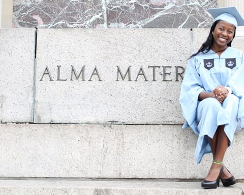 A graduate at a university campus