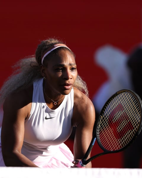 Serena Williams serves during her winning doubles comeback match with Victoria Mboko at Queen's Club in London
