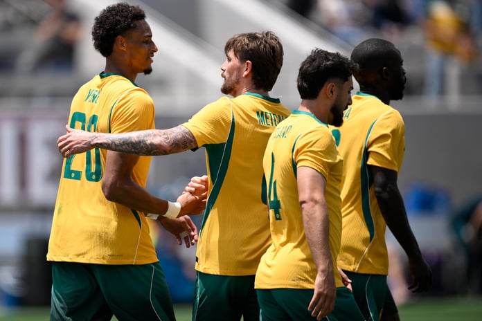 Tete Yengi of Australia celebrates with teammates after scoring on debut against Switzerland at Snapdragon Stadium, San Diego, June 6 2026