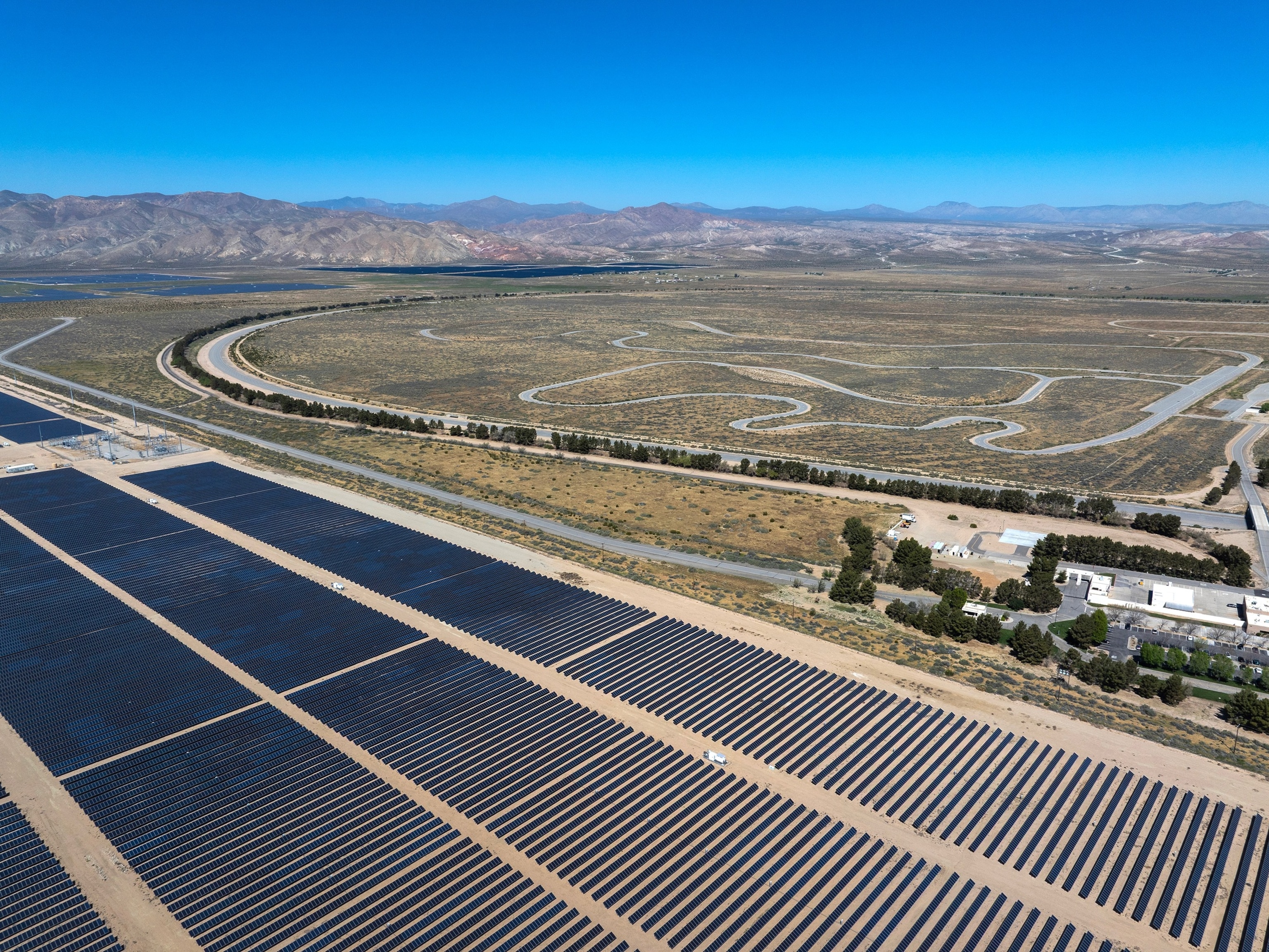 Aerial view of utility-scale solar farms in the Mojave Desert near California City as US solar energy outpaces coal on the national grid in May 2026