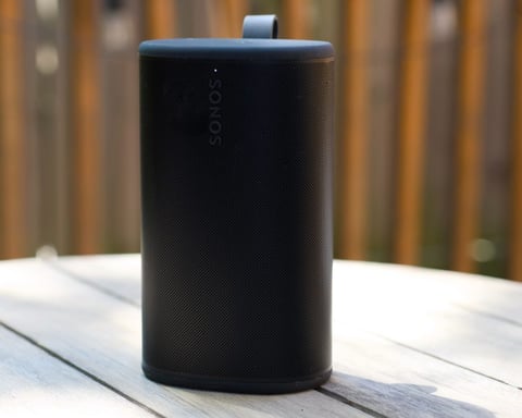 Sonos Play portable speaker in white, showing cylindrical design with carry loop and top controls
