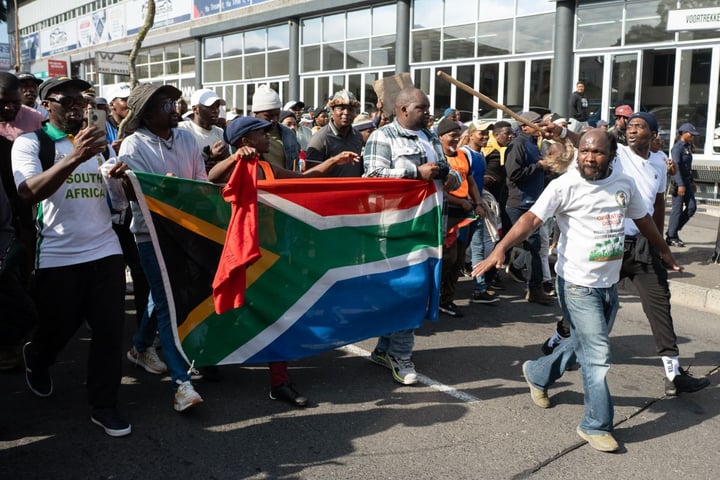 Demonstrators protest against undocumented migrants in Cape Town as anti-migrant violence spreads in South Africa