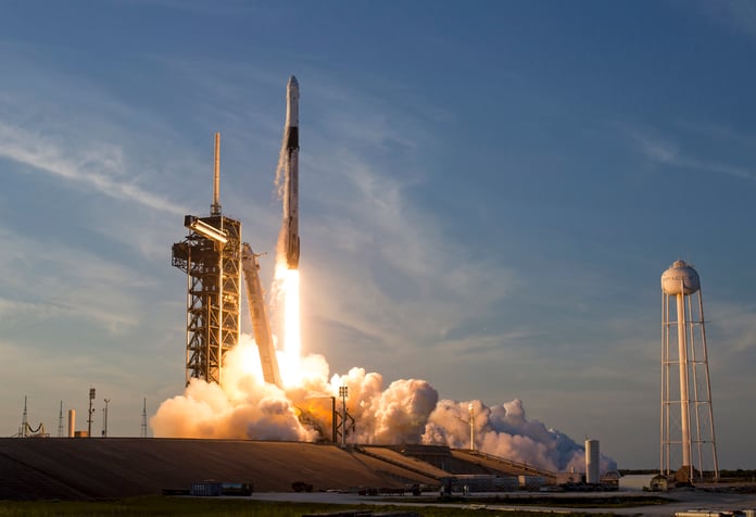 SpaceX Falcon 9 rocket lifting off from Kennedy Space Center ahead of the company's record Nasdaq IPO