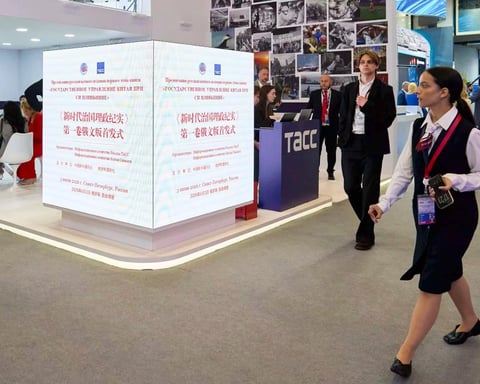 Delegates walk through the exhibition hall at the 29th St. Petersburg International Economic Forum, June 2026