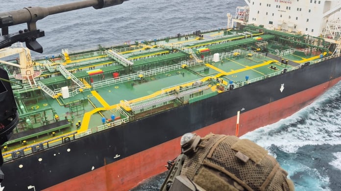 French Navy personnel approach the sanctioned oil tanker Tagor in the Atlantic Ocean