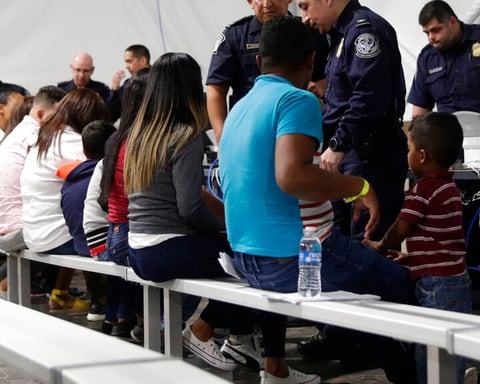 Migrants going through an asylum processing area