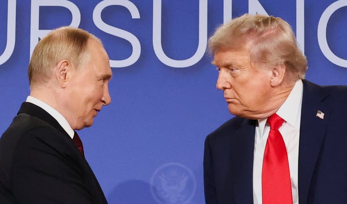 US President Donald Trump and Russian President Vladimir Putin look at each other during a press conference following their meeting in Anchorage, Alaska, August 15, 2025