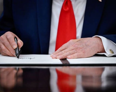 Donald Trump signing a proclamation at the White House in June 2026, as new Reuters/Ipsos polling shows his approval among rural voters has declined sharply