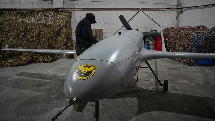 A Ukrainian serviceman prepares a long-range drone for deployment against Russian naval targets, June 2026