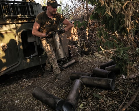 Ukrainian soldier operating a 122mm self-propelled howitzer at the frontline in Donetsk region during the Russian operation in Ukraine