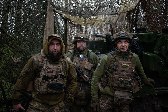 Ukrainian soldier from 148th Artillery Brigade walks along trench at Pokrovsk front-line position Donetsk Oblast January 2026 as Russia seizes Khimik DPR