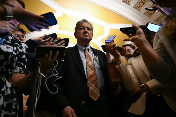 A US senator speaks to reporters outside the Senate chamber at the US Capitol in Washington